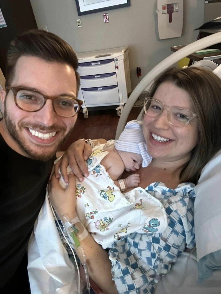 George Kamel with his wife and new born